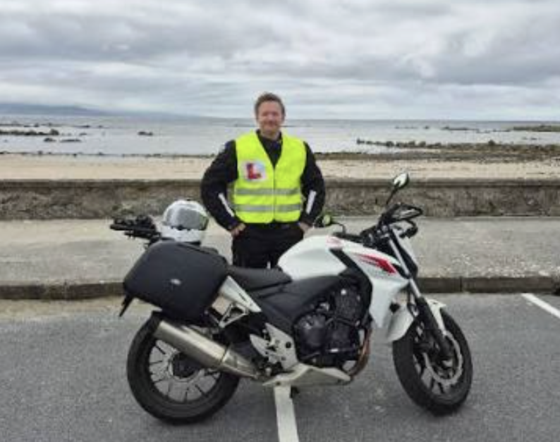 Mick with motorcycle by the Irish coast